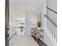 Bright and airy entryway with a console table and view to living room at 1018 Lovebug Ln, Summerville, SC 29485