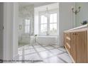 Elegant bathroom with freestanding tub, shower, and dual vanity at 3215 Pine Needle Ln, Seabrook Island, SC 29455