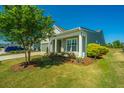 House exterior showcasing a porch with seating and well-maintained landscaping at 145 Hedera Ct, Summerville, SC 29486