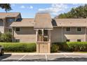 Tan colored building exterior with parking at 121 High Hammock Villas # 121, Seabrook Island, SC 29455