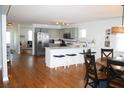 Open kitchen boasts stainless steel appliances and a breakfast bar at 32 41St Ave, Isle of Palms, SC 29451
