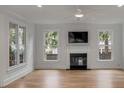 Spacious living room with fireplace and hardwood floors at 517 Royall Ave, Mount Pleasant, SC 29464