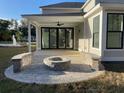 Covered patio with fire pit and built-in seating at 2213 Sally Gaillard Ln, Mount Pleasant, SC 29466