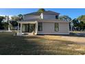 Rear view of a two story home showcasing a patio and fire pit at 2213 Sally Gaillard Ln, Mount Pleasant, SC 29466