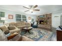 Spacious living room featuring a brick fireplace and comfy seating at 1085 Overton Dr, Moncks Corner, SC 29461