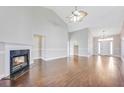 Bright living room featuring hardwood floors and a fireplace at 1206 Creek Stone Way, Hanahan, SC 29410