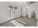 Bright living area with French doors leading to a deck at 1 Dingle St, Charleston, SC 29403