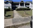 Two story light gray building with exterior stairs at 2502 Hidden Gove Dr, Moncks Corner, SC 29461