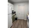 Kitchen with white refrigerator and green cabinets at 2150 Spoleto Ln # B-6, North Charleston, SC 29406