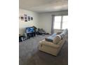 Living room featuring two sofas and large windows at 2150 Spoleto Ln # B-6, North Charleston, SC 29406
