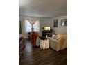 Living room with hardwood floors, neutral decor, and a flat-screen TV at 2150 Spoleto Ln # B-3, North Charleston, SC 29406