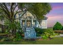 Two story home with large front porch and landscaped yard at 4233 Haulover Dr, Johns Island, SC 29455