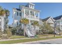 Two-story house with front porch and palm trees at 2600 Josiah St, Charleston, SC 29492