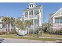 Two-story house with front porch and palm trees at 2600 Josiah St, Charleston, SC 29492