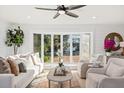 Bright living room with bay windows and comfortable seating at 1894 Capri Dr, Charleston, SC 29407