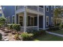 House exterior with front porch and landscaping at 155 Village Ponds Dr, Summerville, SC 29483