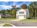 Two-story house with white siding, brick bottom, and two-car garage at 370 Spruce Ivy St, Moncks Corner, SC 29461