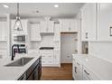 Modern kitchen with white cabinets, quartz countertops, and stainless steel appliances at 175 Cantona Dr, Summerville, SC 29483