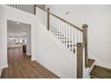 Bright entryway with hardwood floors and a staircase with white railings at 175 Cantona Dr, Summerville, SC 29483