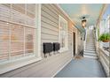 Covered porch with stairs, mailboxes, and light fixture at 175 Wentworth St # A, Charleston, SC 29401