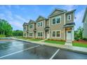 Tan townhouses with ample parking in front at 1103 Twin Rivers Drive # 71, Wando, SC 29492