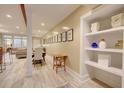 Bright basement hallway with built-in shelving and gallery wall at 241 E Bay St # 102, Charleston, SC 29401