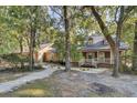 Ranch style home with a large front porch and landscaping at 4429 Francis Younge Way, Hollywood, SC 29449