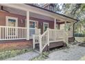 Front porch with a wooden staircase and railing at 4429 Francis Younge Way, Hollywood, SC 29449