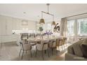 Open concept kitchen and dining area with large table at 527 Helmsman St # 527, Daniel Island, SC 29492