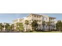 Building exterior with balconies, palm trees, and a paved road at 540 Helmsman St # 1225, Daniel Island, SC 29492