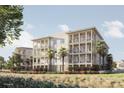 3-story building with balconies, palm trees, and grassy areas at 540 Helmsman St # 1225, Daniel Island, SC 29492