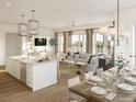 Open concept dining area with kitchen and living room at 540 Helmsman St # 1221, Daniel Island, SC 29492