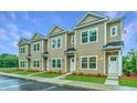 New townhouses with attractive siding and landscaping at 701 Twin Rivers Dr # 41, Wando, SC 29492