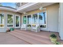 Deck with wicker chairs and a view of the marsh at 169 Marsh Island Dr, Kiawah Island, SC 29455