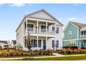Two-story home with blue shutters and a porch at 218 Symphony Ave, Summerville, SC 29486