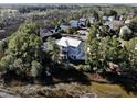 Aerial view of a house nestled in a neighborhood by the water at 1999 N Creek Dr, Mount Pleasant, SC 29466