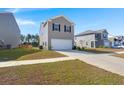 Detached garage with driveway, and well-manicured lawn at 728 Ladywood Dr, Summerville, SC 29486