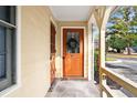 Residential entryway with orange door and porch at 2150 Spoleto Ln # H7, North Charleston, SC 29406