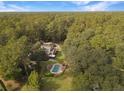 House with pool and large backyard, surrounded by trees at 102 Flud St, Summerville, SC 29483