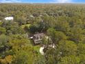 House nestled in a wooded area with a long driveway at 102 Flud St, Summerville, SC 29483