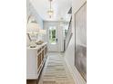 Bright and airy entryway with stylish console table and statement art at 295 Claret Cup Way, Charleston, SC 29414