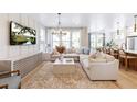 Bright and airy living room featuring a comfortable sectional sofa and large TV at 295 Claret Cup Way, Charleston, SC 29414