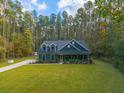 Aerial view of a house nestled in a wooded area at 112 Canewood Ln, Ridgeville, SC 29472