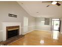 Bright living area with hardwood floors, fireplace and neutral walls at 110 Smithfield Ave, Summerville, SC 29485