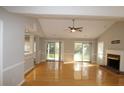 Spacious living room with hardwood floors, fireplace, and access to backyard at 110 Smithfield Ave, Summerville, SC 29485