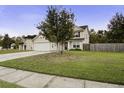 Two-story house with a two-car garage and front yard at 174 Education Blvd, Ladson, SC 29456