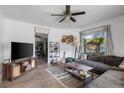 Cozy living room with sectional sofa and large window at 156 E Main St, Harleyville, SC 29448