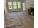 Spacious living room with large windows and hardwood floors at 369 Wappoo Trace Ln, Summerville, SC 29486