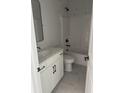 Modern bathroom with white vanity, black fixtures, and gray tile at 369 Wappoo Trace Ln, Summerville, SC 29486