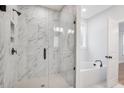 Elegant bathroom featuring a large marble shower and soaking tub at 364 Wappoo Trace Ln, Summerville, SC 29486
